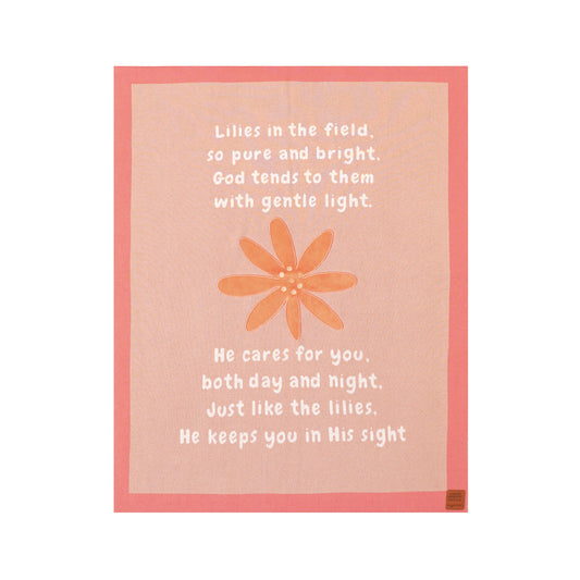 Close-up of pink baby blanket with "Lilies in the field" faith design and Matthew 6:26 poem for comfort.